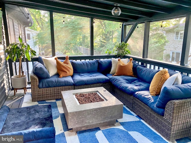 7910 Bayberry Dr, Alexandria, VA 22306 - sunroom featuring an outdoor living space with a fire pit, plenty of natural light, and beamed ceiling