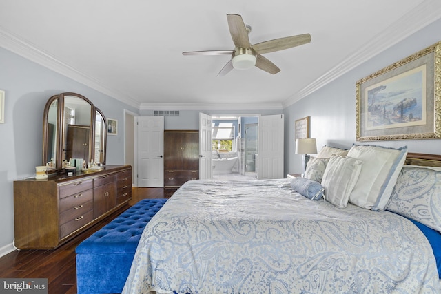 bedroom with visible vents, crown molding, dark wood-style flooring, connected bathroom, and a ceiling fan