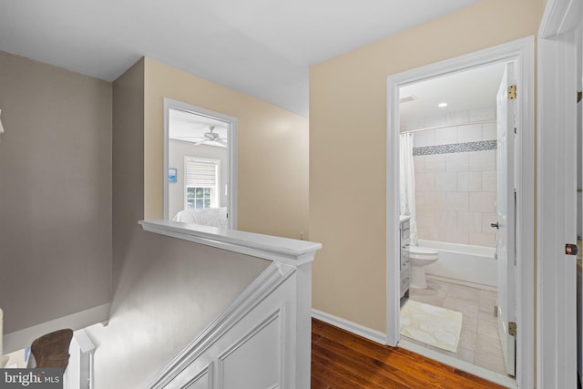 corridor with baseboards, dark wood-style flooring, and visible vents