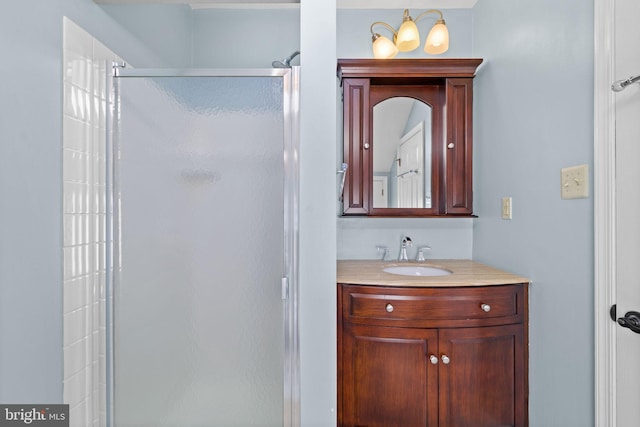 bathroom with vanity and a stall shower