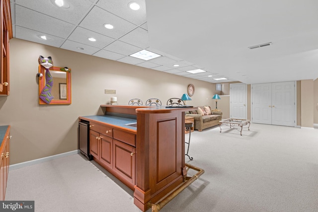 home office featuring recessed lighting, baseboards, visible vents, and light carpet