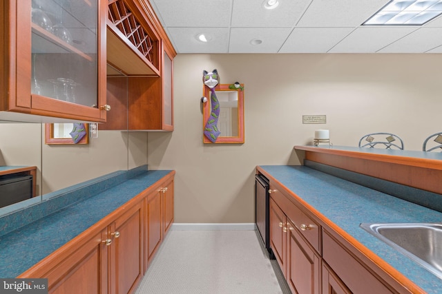 interior space with a sink, baseboards, and recessed lighting