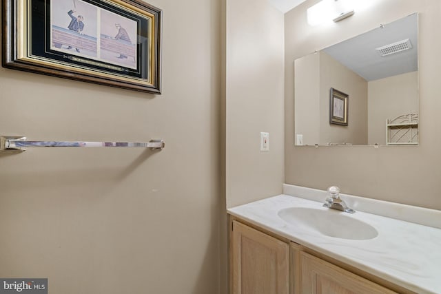 bathroom with vanity and visible vents