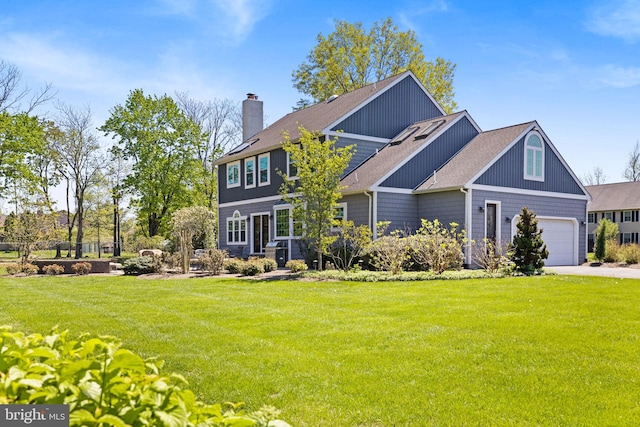 craftsman-style home with concrete driveway, a shingled roof, a chimney, and a front yard
