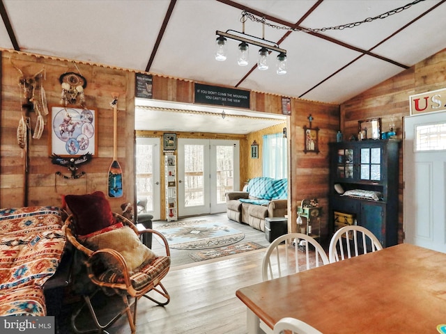29 Roy Guinn Rd, Points, WV 25437 - dining room featuring vaulted ceiling, wood finished floors, wood walls, and french doors