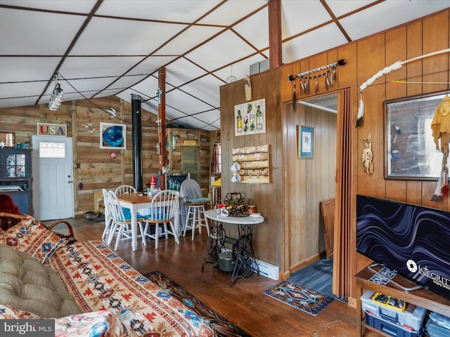 29 Roy Guinn Rd, Points, WV 25437 - dining room featuring wood walls, lofted ceiling, and wood finished floors