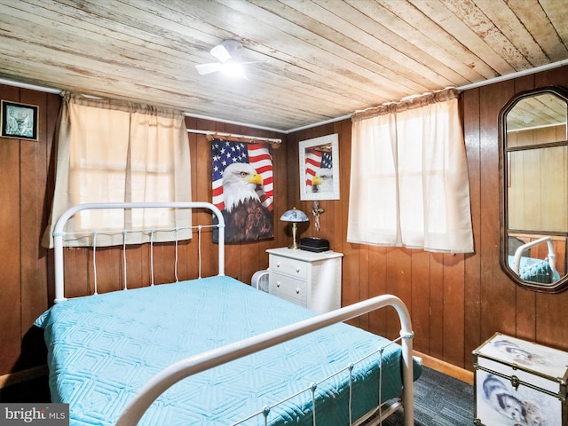 29 Roy Guinn Rd, Points, WV 25437 - carpeted bedroom featuring wooden ceiling, wood walls, and multiple windows