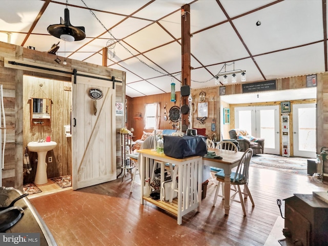 29 Roy Guinn Rd, Points, WV 25437 - living room with a barn door, wood walls, and hardwood / wood-style floors