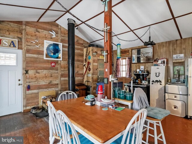 29 Roy Guinn Rd, Points, WV 25437 - dining room with vaulted ceiling, wood walls, and wood finished floors
