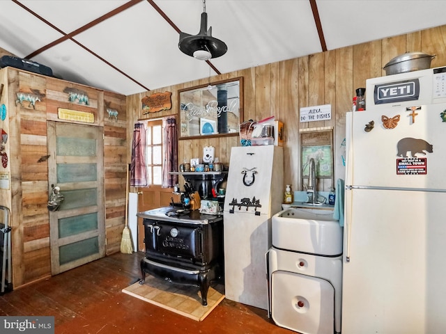 29 Roy Guinn Rd, Points, WV 25437 - kitchen with wood walls, a wood stove, and freestanding refrigerator