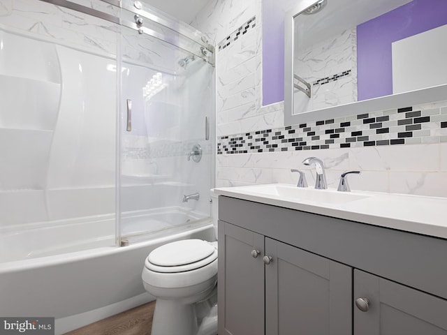 9 Honeysuckle Dr, Newark, DE 19702 - full bath featuring bathing tub / shower combination, toilet, tile walls, wood finished floors, and vanity