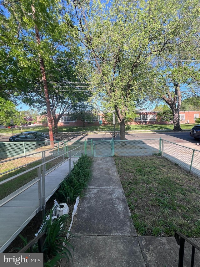 view of yard featuring fence and a gate