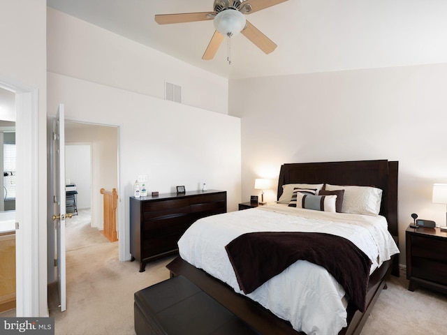 bedroom with ceiling fan, visible vents, and light colored carpet