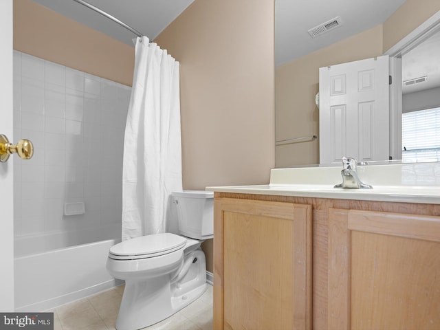 bathroom with toilet, vanity, tile patterned floors, and visible vents