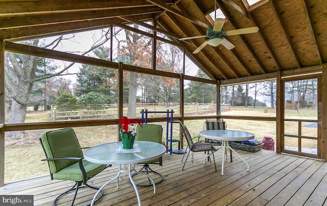 sunroom with ceiling fan and outdoor dining area