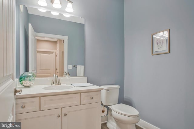 170 Harrier Way Unit 32, Chester, MD 21619 - half bathroom featuring baseboards, vanity, and toilet