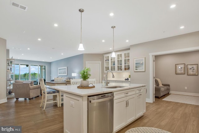 170 Harrier Way Unit 32, Chester, MD 21619 - kitchen with light wood finished floors, dishwasher, visible vents, a sink, and open floor plan