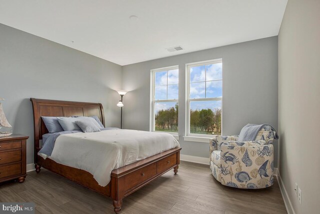 170 Harrier Way Unit 32, Chester, MD 21619 - bedroom with baseboards, wood finished floors, and visible vents