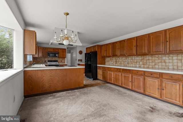 29 Foxcroft Dr, Princeton, NJ 08540 - kitchen featuring light countertops, a chandelier, black appliances, decorative backsplash, and light carpet