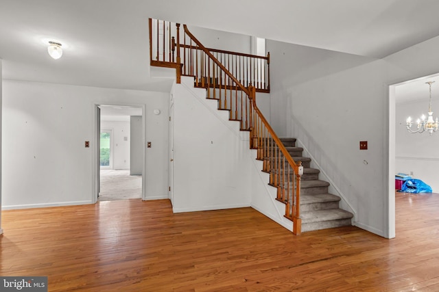 29 Foxcroft Dr, Princeton, NJ 08540 - stairway featuring wood finished floors, an inviting chandelier, and baseboards