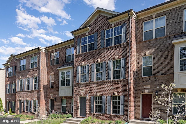 15993 Marsh Pl, Haymarket, VA 20169 - townhome / multi-family property featuring brick siding