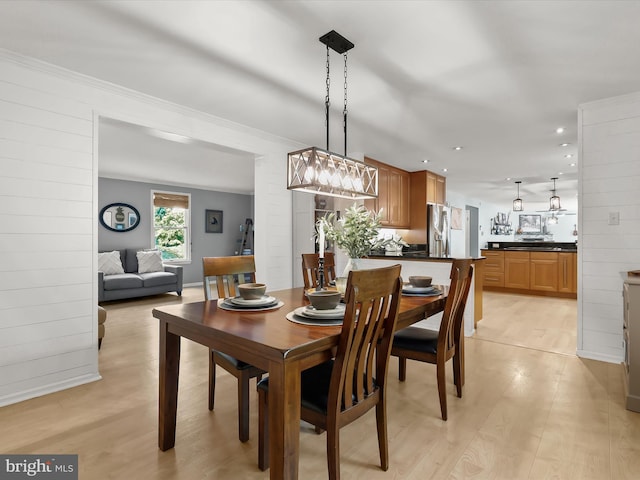 dining space with light wood-style floors and recessed lighting