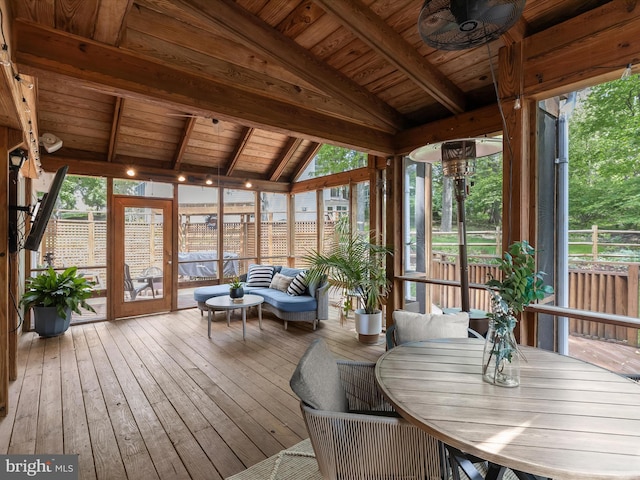 sunroom with a deck, hardwood / wood-style flooring, ceiling fan, and wood ceiling