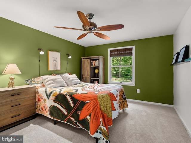 bedroom with carpet floors, baseboards, and ceiling fan
