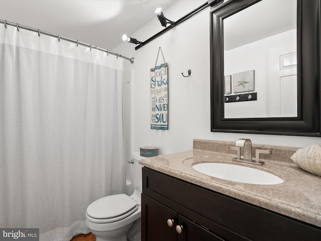 bathroom with toilet and vanity