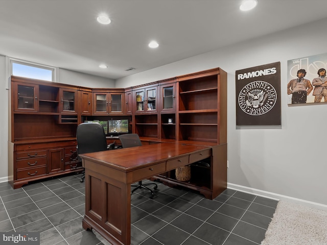 office area featuring baseboards, dark tile patterned flooring, and recessed lighting