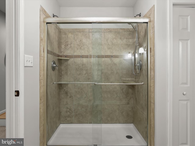 full bathroom with a shower stall