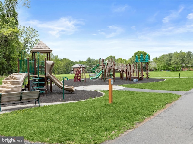 community play area with a lawn