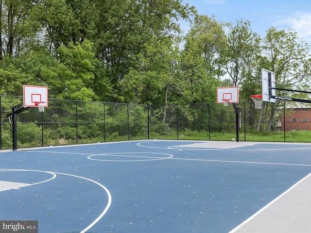 view of sport court featuring community basketball court and fence