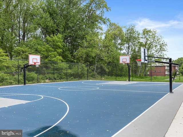 view of sport court with community basketball court and fence