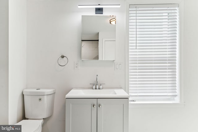 bathroom featuring toilet and vanity