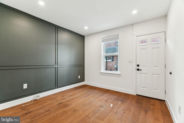 entrance foyer with wood finished floors, baseboards, and recessed lighting