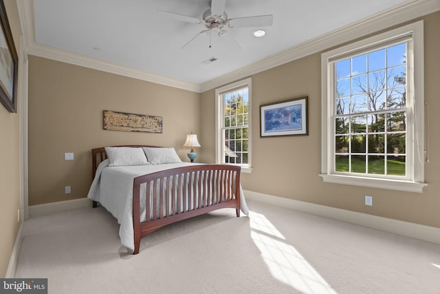bedroom featuring crown molding, light colored carpet, visible vents, ceiling fan, and baseboards