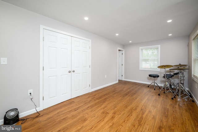 interior space with recessed lighting, baseboards, and wood finished floors