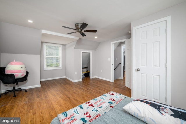 bedroom with wood finished floors, recessed lighting, vaulted ceiling, ceiling fan, and baseboards