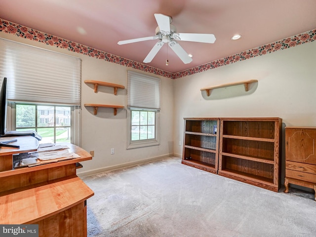 unfurnished office featuring carpet flooring, recessed lighting, ceiling fan, and baseboards