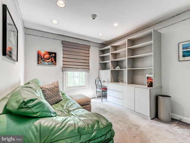 living area featuring recessed lighting, baseboards, and carpet
