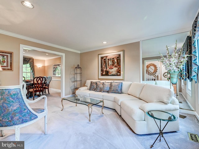 living area featuring visible vents, ornamental molding, baseboards, recessed lighting, and carpet