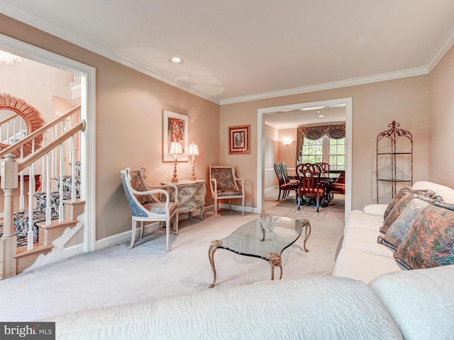 carpeted living area featuring crown molding, baseboards, and stairs