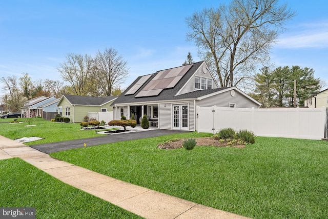 11 New Coach Pl, Willingboro, NJ 08046 - view of front of home with french doors, solar panels, driveway, and a shingled roof