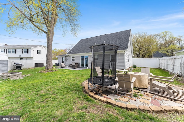 11 New Coach Pl, Willingboro, NJ 08046 - back of house featuring a patio, roof with shingles, an outdoor living space with a fire pit, and central air condition unit