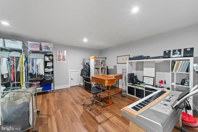 office area featuring baseboards, wood finished floors, and recessed lighting