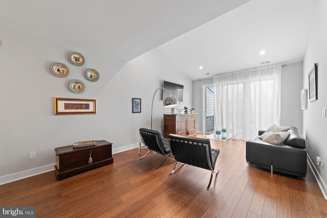 living room with recessed lighting, vaulted ceiling, wood finished floors, and baseboards