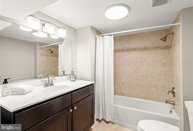 full bathroom featuring shower / bath combo, tile patterned flooring, vanity, toilet, and visible vents