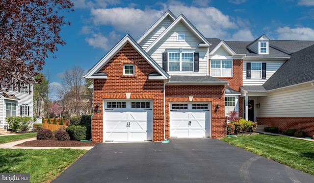 townhome / multi-family property with brick siding, an attached garage, a shingled roof, and driveway