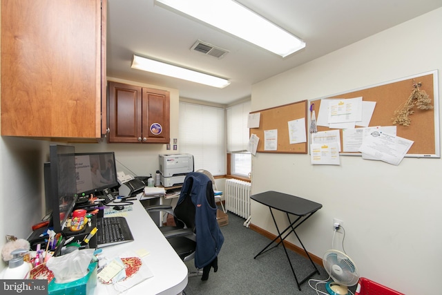 office space featuring visible vents, carpet flooring, and radiator